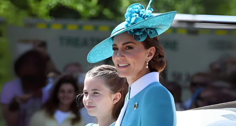 Royal Shock As Charlotte Longs For Harry’s California Life 1 Catherine, Princess of Wales, and Princess Charlotte in blue outfits on a carriage balcony.
